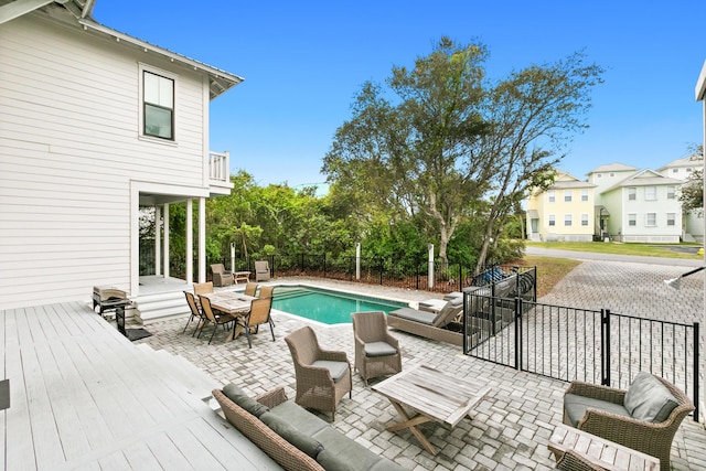 12 Seabreeze Way, Inlet Beach, FL 32461 - view of pool featuring a fenced backyard, a patio, a wooden deck, outdoor lounge area, and outdoor dining area