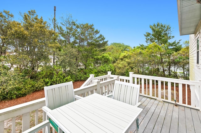 12 Seabreeze Way, Inlet Beach, FL 32461 - deck featuring outdoor dining space and view of scattered trees