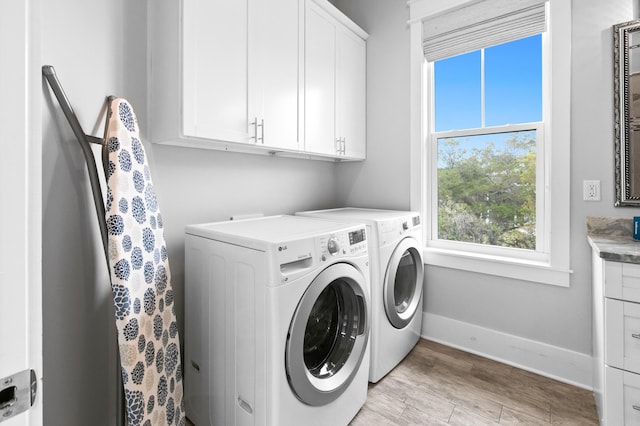 12 Seabreeze Way, Inlet Beach, FL 32461 - laundry room with plenty of natural light, cabinet space, washer and dryer, and light wood-type flooring