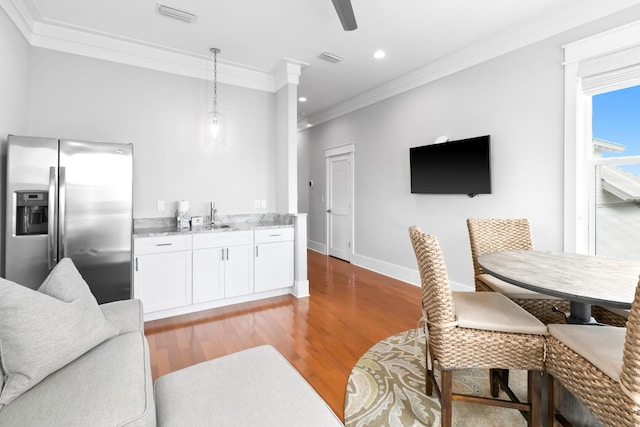 12 Seabreeze Way, Inlet Beach, FL 32461 - living area featuring ornamental molding, light wood-style flooring, a ceiling fan, recessed lighting, and bar