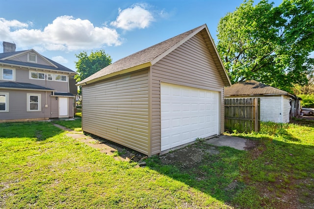 detached garage with fence