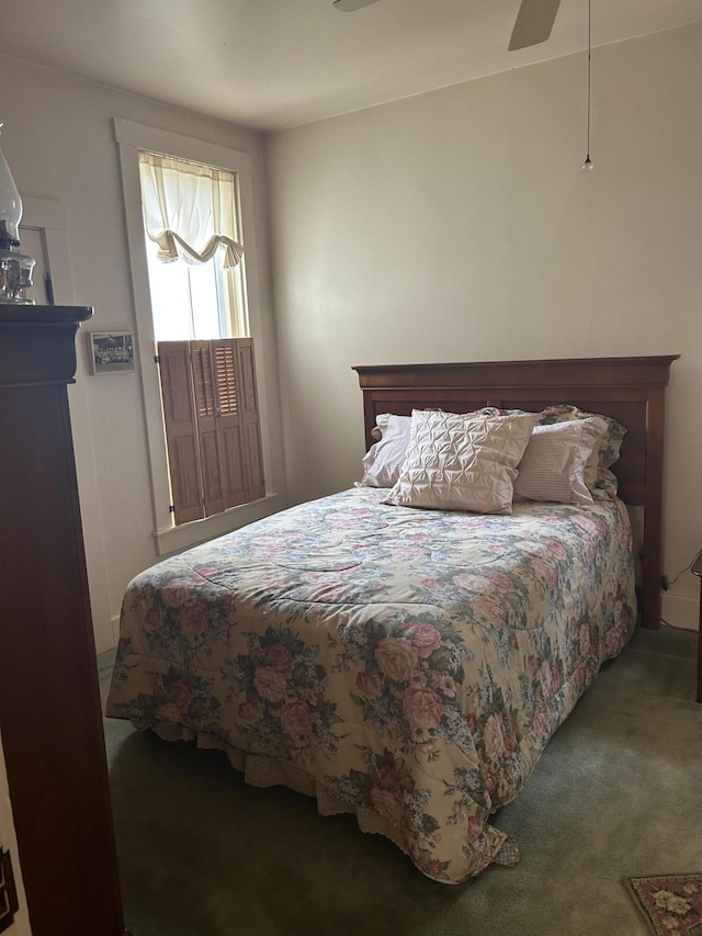 carpeted bedroom with ceiling fan