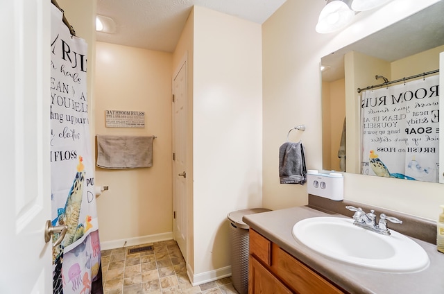 bathroom with vanity and walk in shower