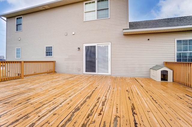 back of property featuring a wooden deck