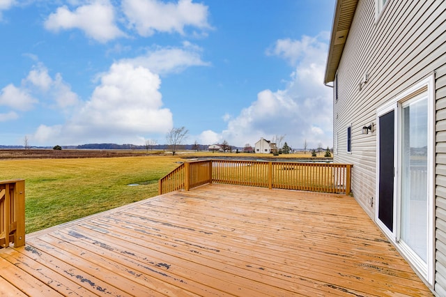 wooden deck featuring a yard