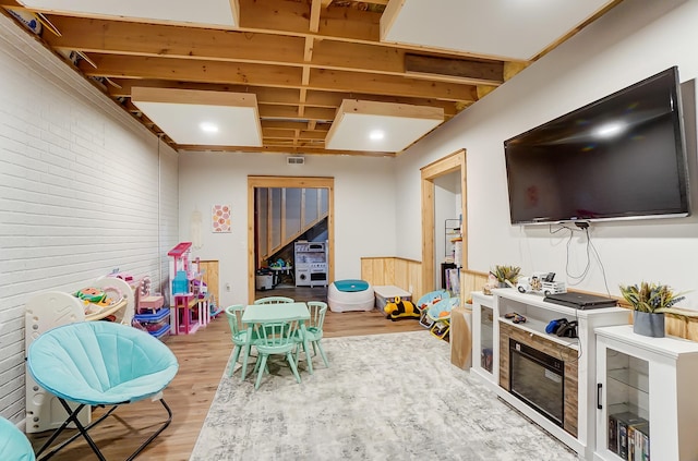 recreation room featuring hardwood / wood-style flooring