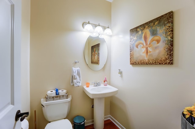 bathroom featuring sink and toilet