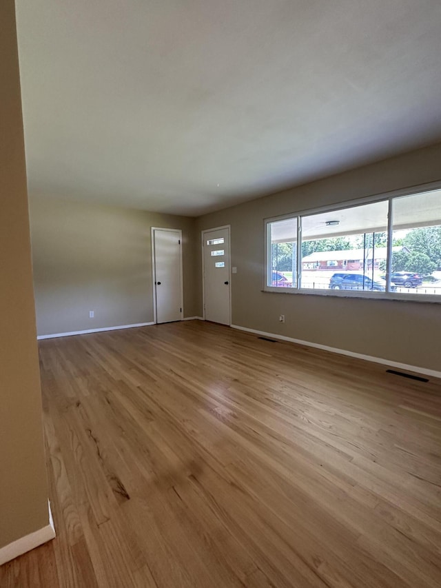 2336 Derr Rd, Springfield, OH 45503 - unfurnished living room featuring baseboards and wood finished floors