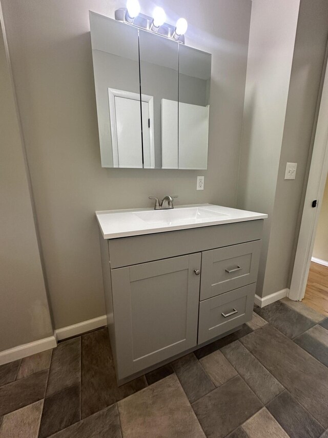 2336 Derr Rd, Springfield, OH 45503 - bathroom featuring vanity and stone finish flooring