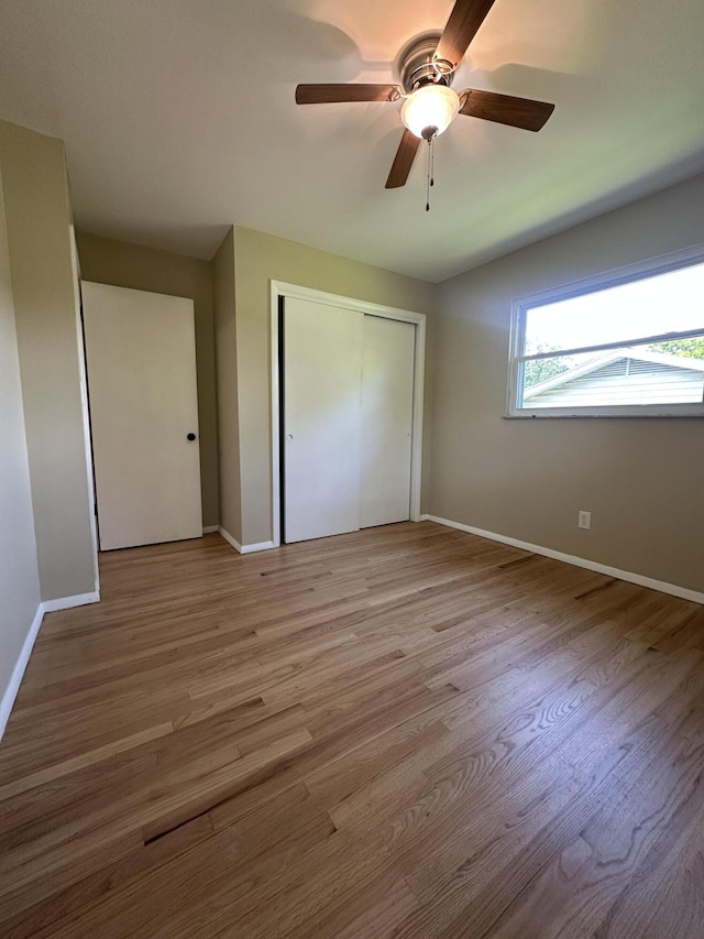 2336 Derr Rd, Springfield, OH 45503 - unfurnished bedroom with a closet, light wood-type flooring, and a ceiling fan