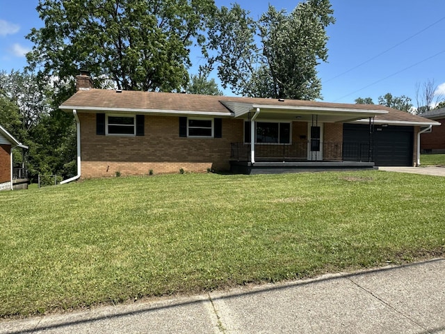 2336 Derr Rd, Springfield, OH 45503 - ranch-style house featuring an attached garage, brick siding, a porch, a chimney, and a front yard