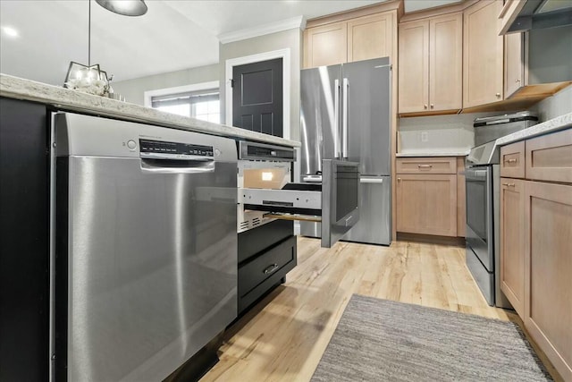 kitchen featuring crown molding, light wood finished floors, stainless steel appliances, light brown cabinetry, and extractor fan