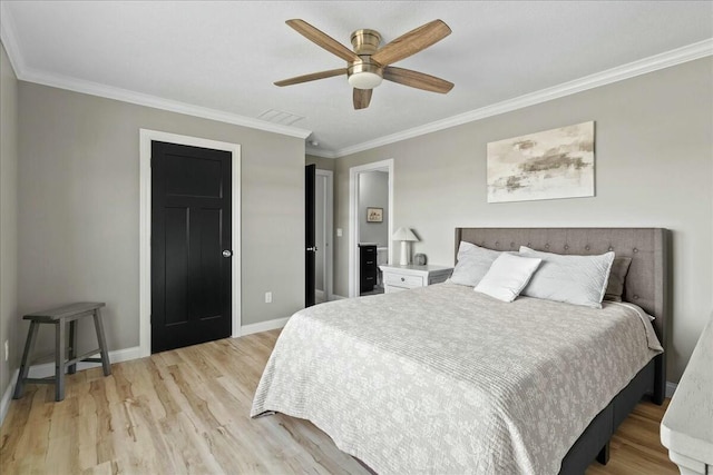 bedroom featuring light wood-type flooring, a ceiling fan, baseboards, and crown molding