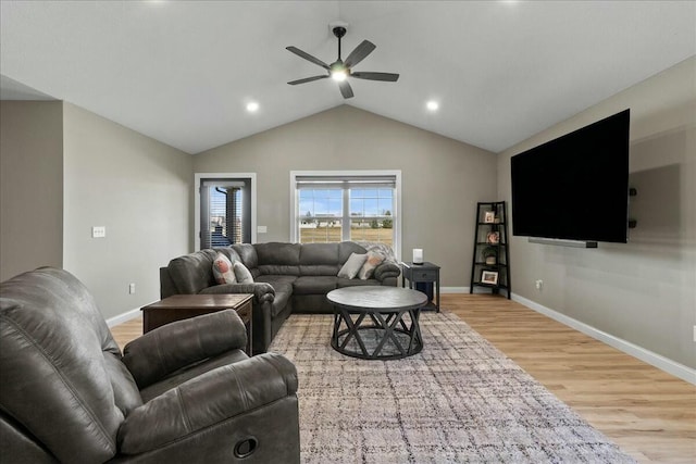 living area with recessed lighting, light wood-style floors, a ceiling fan, vaulted ceiling, and baseboards