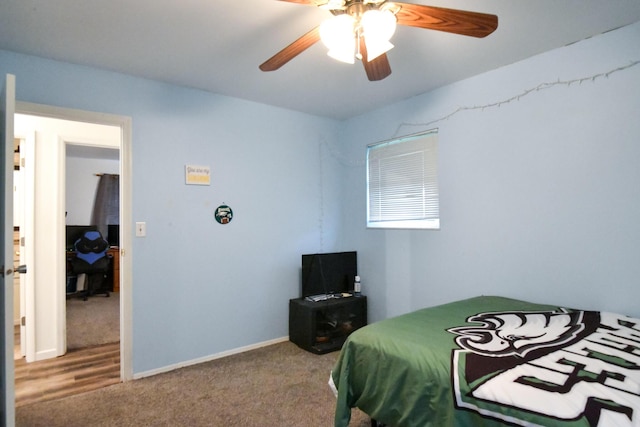 bedroom with carpet floors, baseboards, and ceiling fan