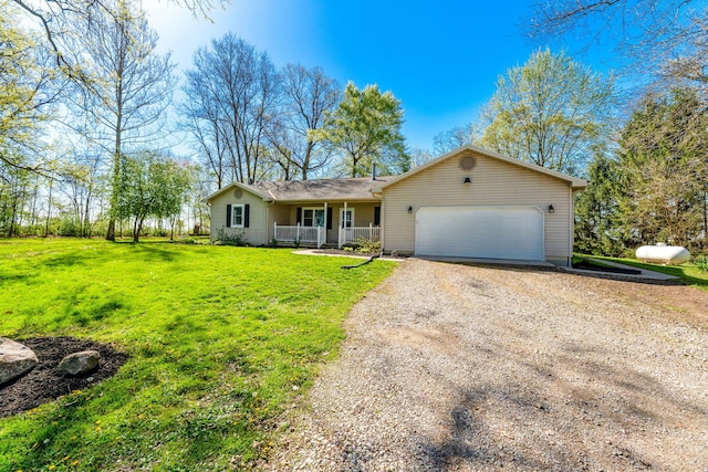 11851 Sanders Rd, Richwood, OH 43344 - ranch-style house with a garage, a front yard, covered porch, and driveway