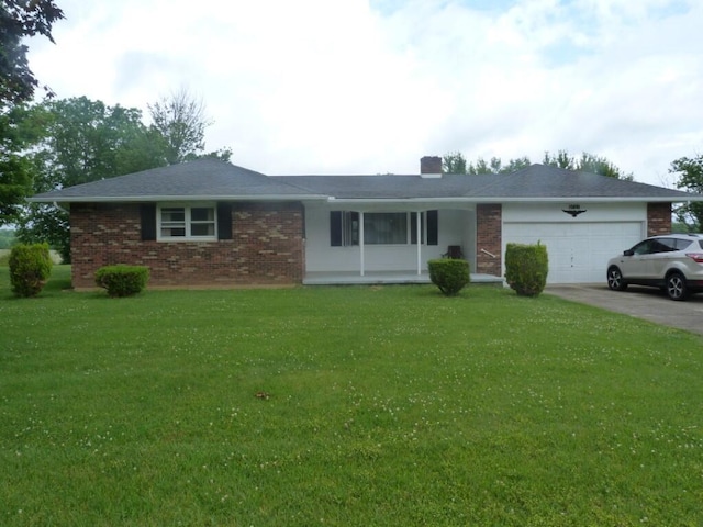 727 County Road 50, Ada, OH 45810 - ranch-style home with an attached garage, brick siding, driveway, a front yard, and a chimney