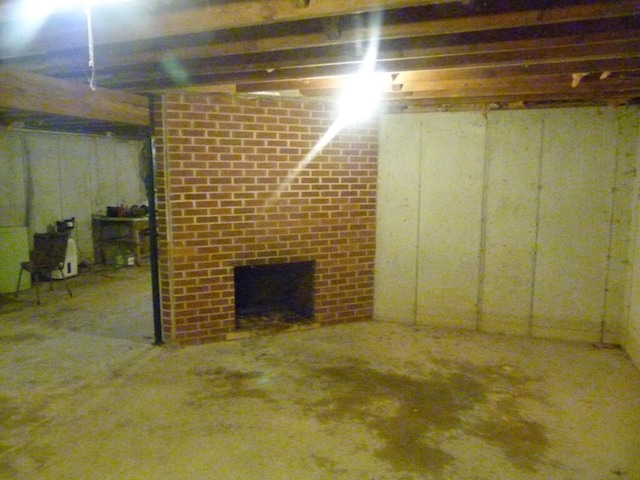 727 County Road 50, Ada, OH 45810 - unfinished basement featuring a brick fireplace