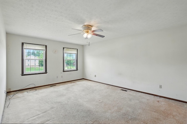 1985 Fox Run, Troy, OH 45373 - carpeted empty room featuring a ceiling fan and a textured ceiling