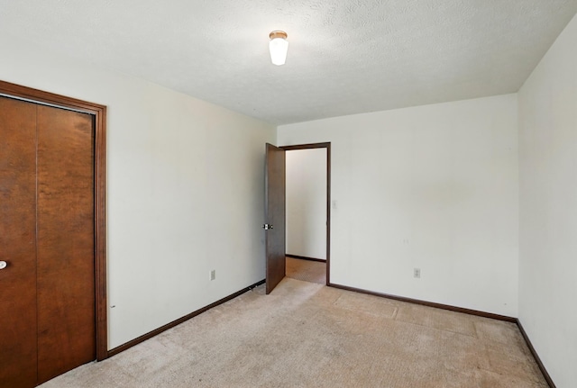 1985 Fox Run, Troy, OH 45373 - unfurnished bedroom with light carpet and a closet