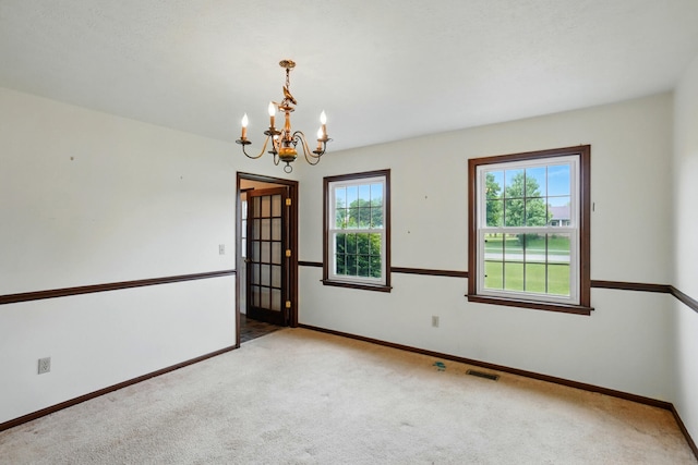 1985 Fox Run, Troy, OH 45373 - carpeted spare room with a chandelier and baseboards