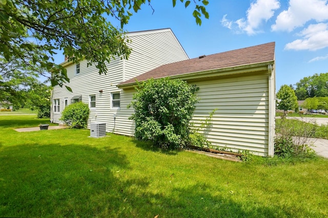 1985 Fox Run, Troy, OH 45373 - view of side of home with a yard and a shingled roof
