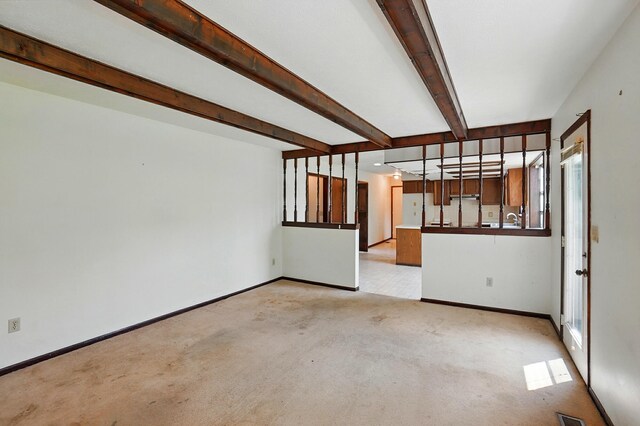 1985 Fox Run, Troy, OH 45373 - empty room featuring light colored carpet and beam ceiling
