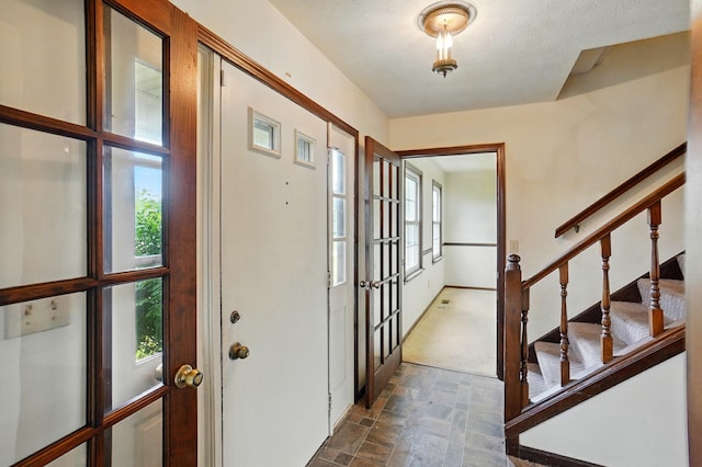 1985 Fox Run, Troy, OH 45373 - entryway with stone finish flooring, plenty of natural light, french doors, and stairs