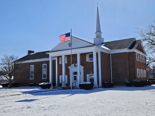view of front of home featuring brick siding