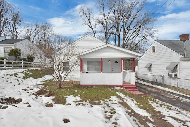 bungalow featuring cooling unit and covered porch