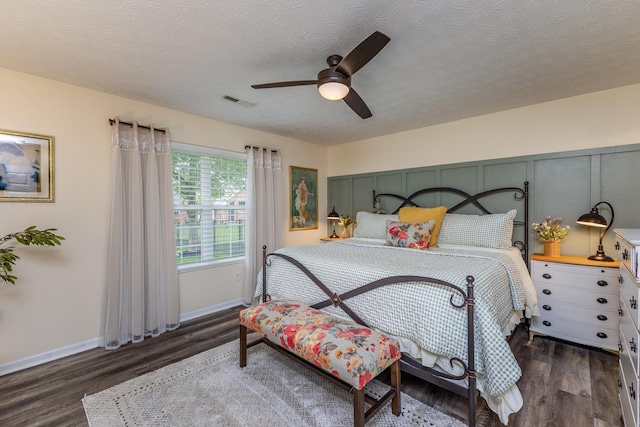 1280 Candlelite Ln, Fairborn, OH 45324 - bedroom featuring wood finished floors, baseboards, ceiling fan, and a textured ceiling