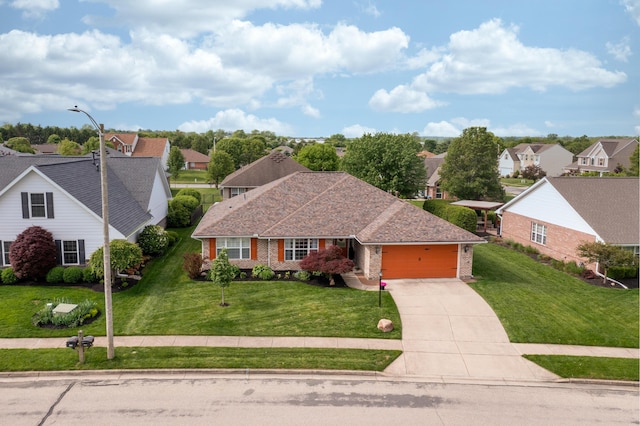 1280 Candlelite Ln, Fairborn, OH 45324 - view of front of home with an attached garage, a residential view, concrete driveway, and a front lawn