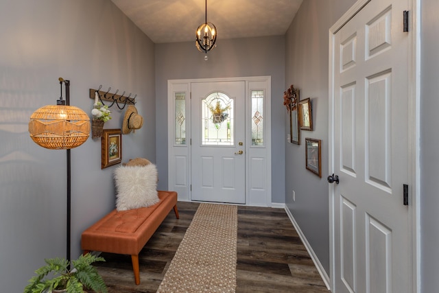 1280 Candlelite Ln, Fairborn, OH 45324 - foyer with dark wood-style floors, a chandelier, and baseboards