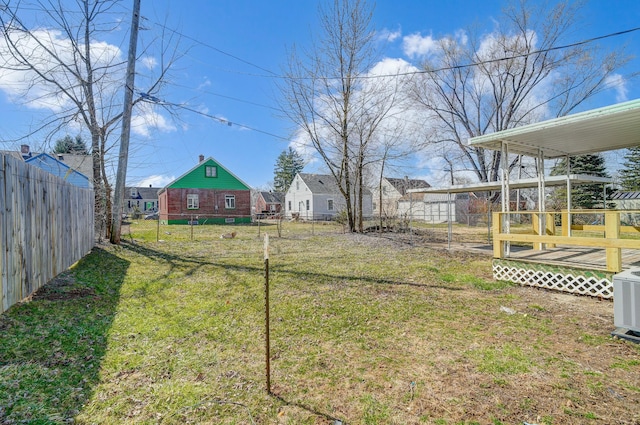 view of yard featuring fence private yard and central AC