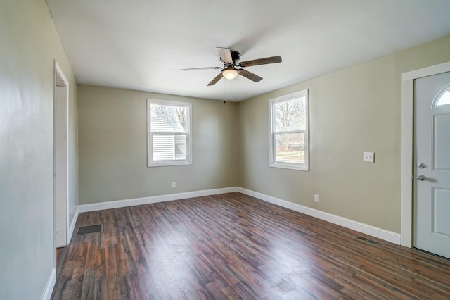 foyer entrance featuring visible vents, baseboards, a ceiling fan, and wood finished floors