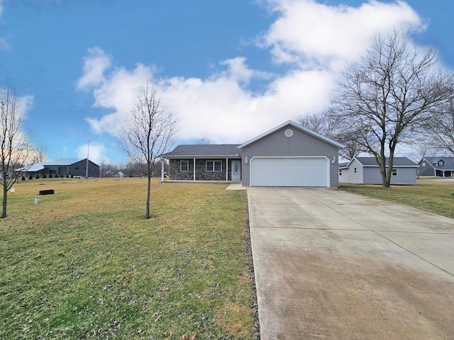 ranch-style house featuring a garage and a front lawn