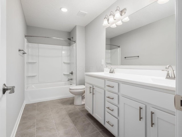 full bathroom featuring a textured ceiling, toilet, a sink, tile patterned floors, and double vanity