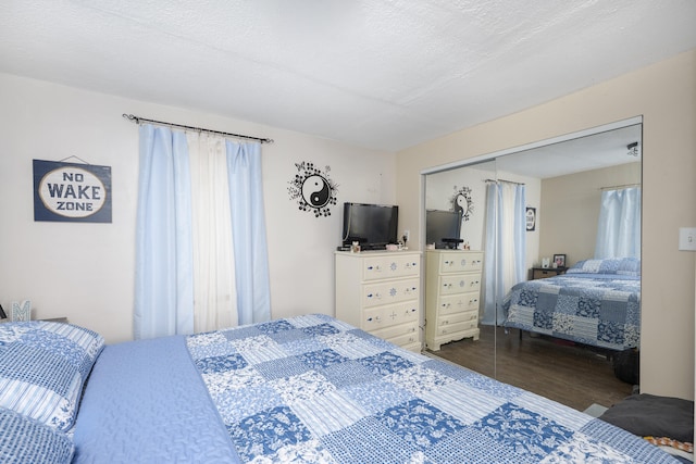 bedroom with a closet and a textured ceiling