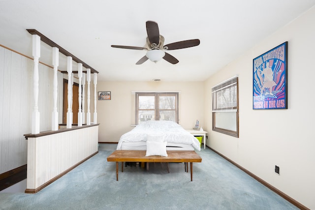 carpeted bedroom with baseboards and a ceiling fan