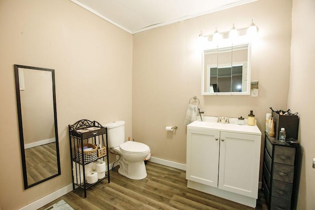 804 Robinson Ave, Kenton, OH 43326 - half bathroom with vanity, wood finished floors, and ornamental molding