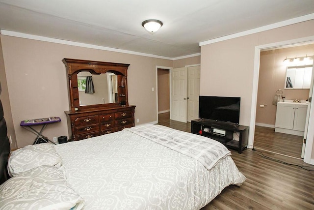 804 Robinson Ave, Kenton, OH 43326 - bedroom featuring wood finished floors, ornamental molding, and ensuite bathroom