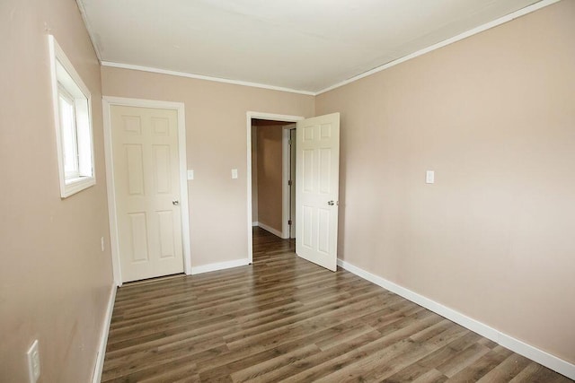 804 Robinson Ave, Kenton, OH 43326 - unfurnished bedroom with wood finished floors and ornamental molding