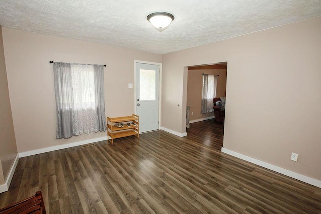 804 Robinson Ave, Kenton, OH 43326 - spare room with a textured ceiling and wood finished floors