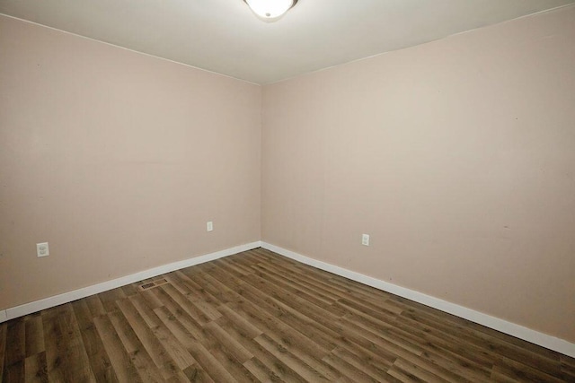 804 Robinson Ave, Kenton, OH 43326 - empty room with baseboards and wood finished floors