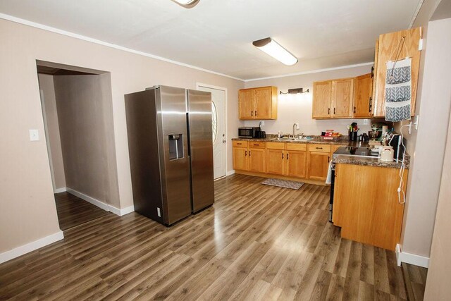 804 Robinson Ave, Kenton, OH 43326 - kitchen with appliances with stainless steel finishes, dark wood-style floors, and ornamental molding