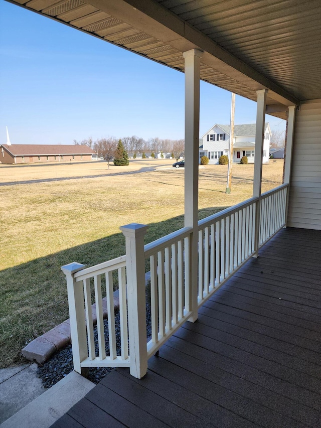 deck with a lawn and a porch