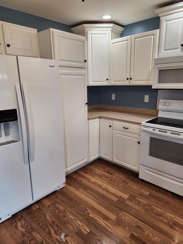 kitchen featuring recessed lighting, white appliances, white cabinets, and dark wood-style flooring