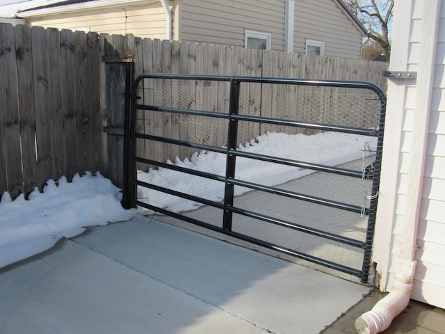 view of snow covered gate