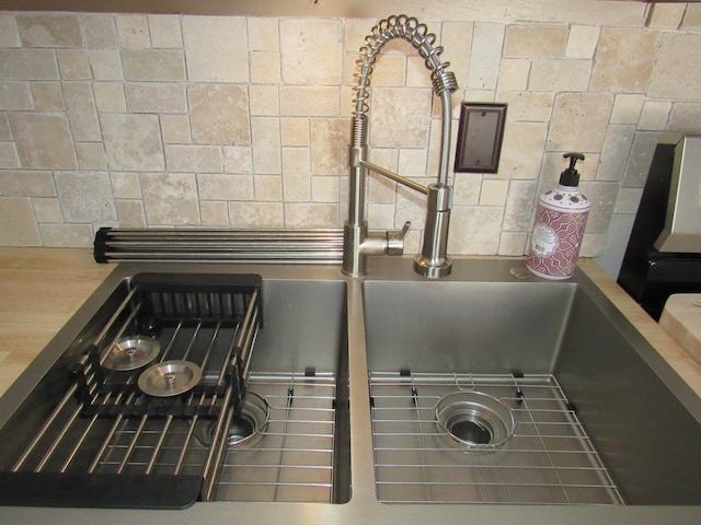 room details featuring sink and butcher block countertops