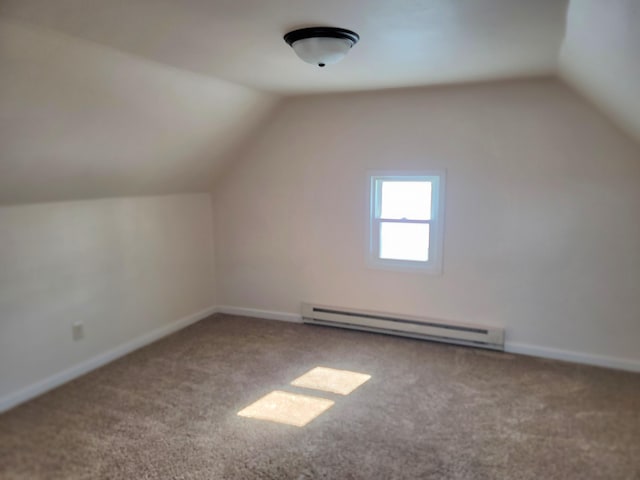 bonus room with baseboard heating, lofted ceiling, and carpet